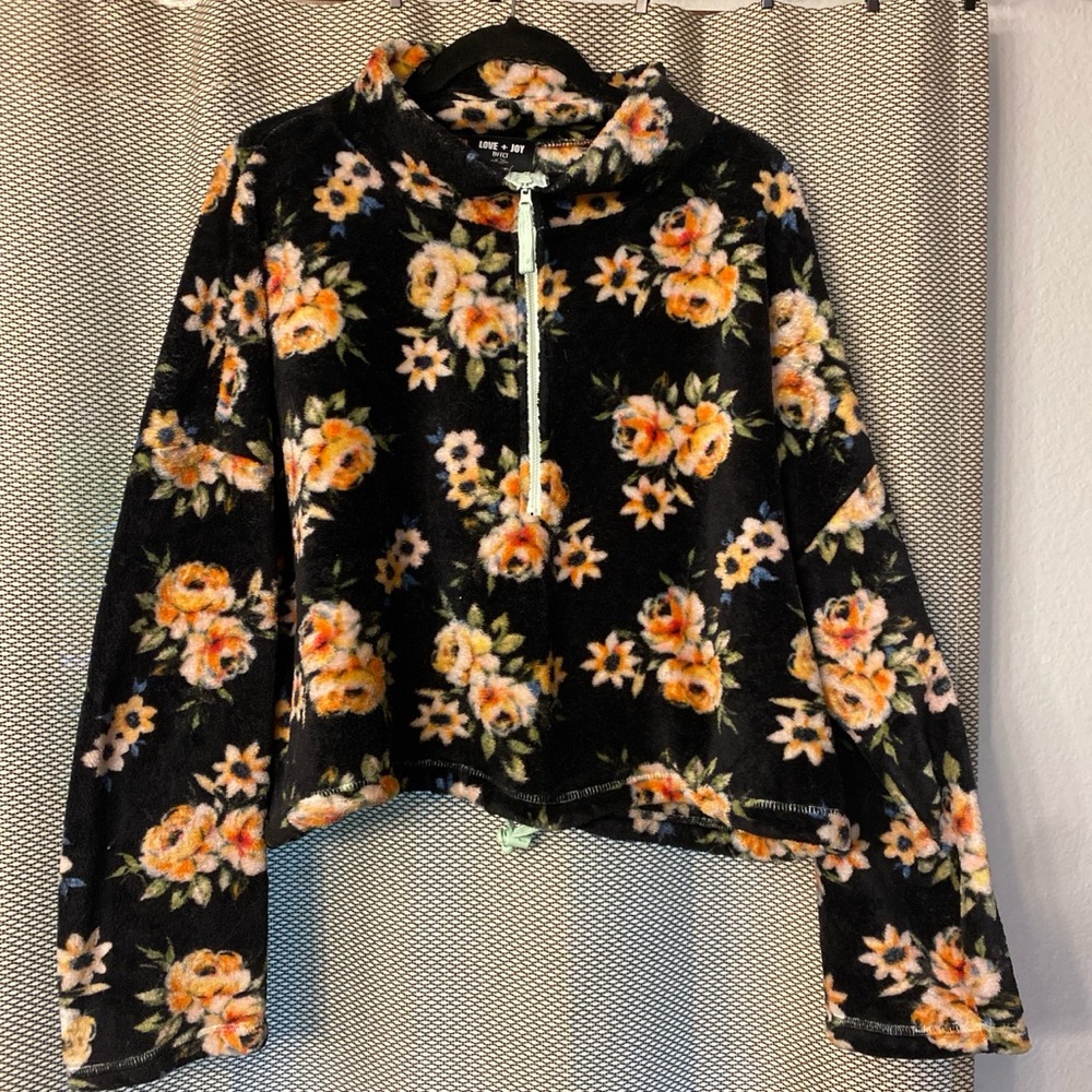 Black fuzzy drawstring crop top with floral pattern